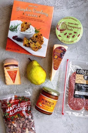 Trader Joe's Fall Charcuterie Board - Dash Of Mandi Small Trader Joes Charcuterie Board, Trader Joe’s Fall Charcuterie Board, Pumpkin Crisp, Trader Joe's, Pumpkin Cranberry, Sliced Pears, Trader Joes Recipes, Fall Snacks, Snack Board