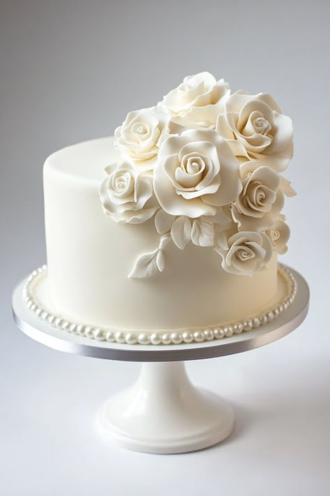 Looking for one tier wedding cakes that are both stunning and simple? Explore a range of single tier designs with elegant flowers, rustic charm, and vintage white details. These ideas are perfect for small weddings that require a touch of sophistication. Elegant 3 Tier Wedding Cakes, Single Tier Engagement Cake, Wedding Cakes 1 Tier, Simple Small Cake, Tall Single Tier Wedding Cake, Two Teir Wedding Cake Elegant, Small Tiered Cake, One Tier Wedding Cakes, Simple Vintage Wedding Cake