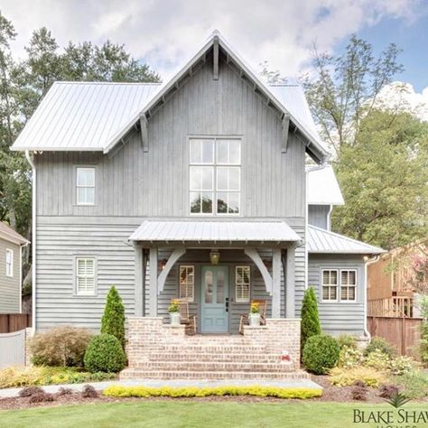 How charming is this rustic farmhouse? The combination of grey cypress, brick and blue door are magnificent! The interior is gorgeous too!… Rustic Farmhouse Exterior, Veranda Design, Eldorado Stone, Porch Design Ideas, Farmhouse Exterior Design, Gray House, Building A Porch, Front Porch Design, Modern Farmhouse Exterior