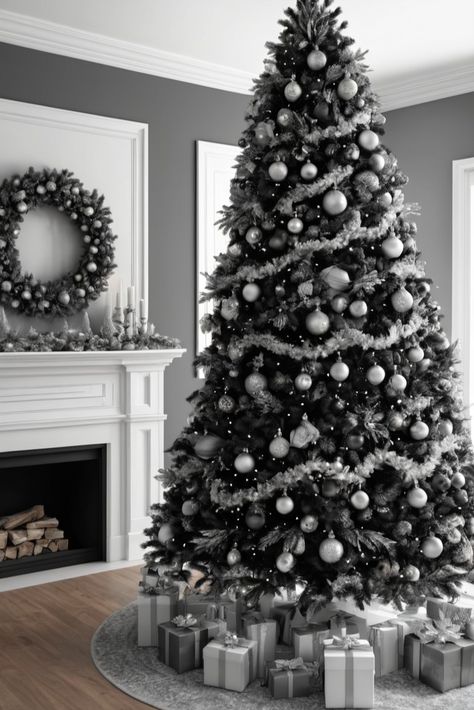 Achieve sleek sophistication this holiday season with a modern monochrome tree in black, white, and silver. Learn how to create a chic and contemporary look that will impress all your guests! White Tree With Silver Decorations, Black And Silver Tree, Black White Silver Christmas Tree, Black White And Silver Christmas Tree, Black Tree Decorating Ideas, Christmas Tree Color Schemes, Christmas Tree Colour Scheme, Black Christmas Decorations, Glam Christmas Tree