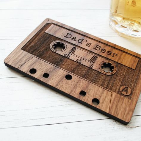 Fun Fact! Did you know the compact cassette was designed in the sixties and used for dictation before they were used for recording music? It also seems they are making a bit of a comeback amongst enthusiasts! You can jump on the trend with our personalised solid wooden version that doubles as a quirky drinks coaster. #cassettetapes #woodpaperscissors #designwithastory #madefromwood #womanwoodworkers #thoughtfulgifting #cornwallbusiness #retrocommunity #madebytheocean #cassettecollection #m... Retro Drinks, Valentine Gift For Dad, House Keyring, Musical Gift, Laser Engraved Ideas, Wooden Cards, The Sixties, Personalized Coasters, Wooden Coasters