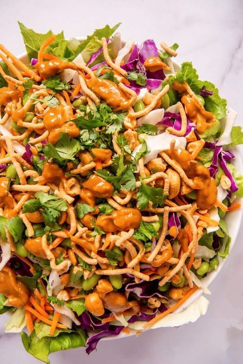 This Asian Salad with homemade spicy peanut dressing is deliciously addicting! Perfect for lunch or dinner. #salad #saladdressing Asian Peanut Salad, Peanut Butter Salad Dressing, Peanut Salad Dressing, Peanut Butter Salad, Crispy Chow Mein Noodles, Salad With Peanut Dressing, Peanut Salad, Thai Chicken Salad, Delicious Salad Dressings