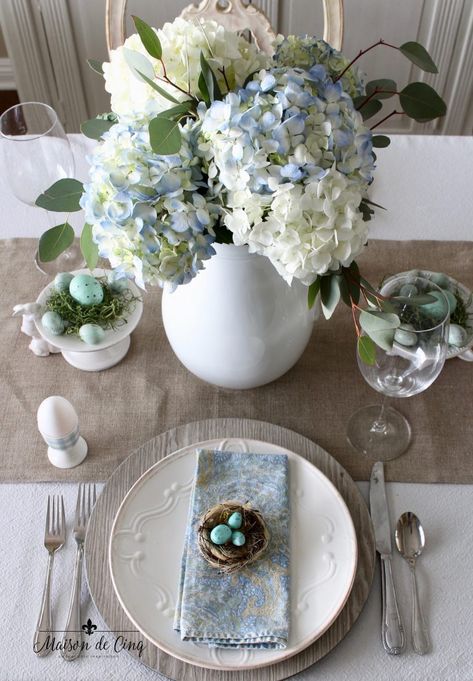 Gorgeous spring tablescape in shades of blue! Robin's egg blue table for spring! Beautiful Easter Table Setting --> #maisondecinq #tablescape #eastertablescape #tablesetting #eastertablesetting #springtable #springtablescape #springtablesetting #eastertable #springtable #springflowers #springentertaining #easterentertaining #eggs #eastereggs #bluetablescape #bluetablesetting #hydrangeas #frenchfarmhouse #farmhousestyle Blue Easter Tablescapes, Blue Easter Decor, Derby Cocktails, Cinco De Mayo Ideas, Kentucky Derby Cocktails, Baseball Party Ideas, Blue Table Settings, Spring Training Baseball, Tablescapes Spring