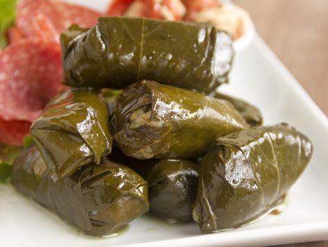 Dolmades (Stuffed Grape Leaves) Dolmas Recipe Greek, Greek Dolmades, Dolmades Recipe, Grape Leaves Recipe, Hot Garlic Sauce, Stuffed Vine Leaves, Spicy Eggplant, Stuffed Grape Leaves, Eggplant Salad