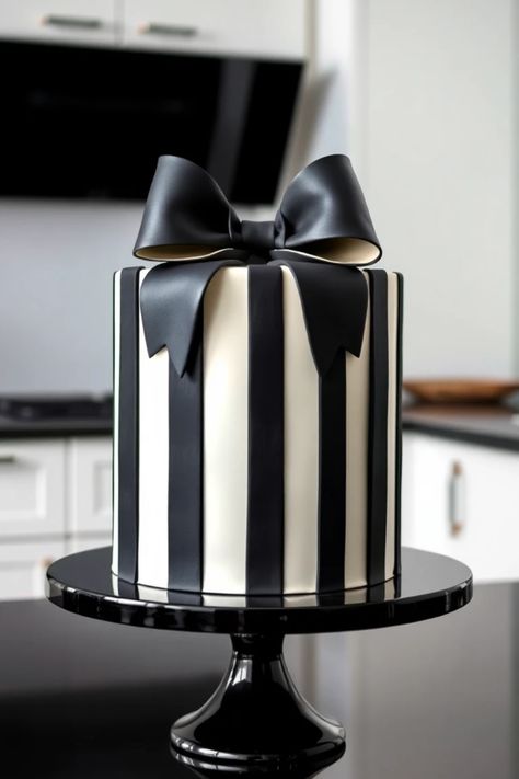 Discover elegant black and white cake ideas that bring sophistication to any celebration. Featuring a beautiful striped bow cake among stunning designs, this Pin inspires confection creativity. Perfect for weddings and birthdays. Black Themed Birthday Party Cake, Black Bow Birthday Cake, Black White Cake Birthday, Black Bow Cake, Black And White Vintage Cake, Classy Birthday Cakes For Ladies, Bow Cake Design, Chic Cake Design, Black And White Striped Cake