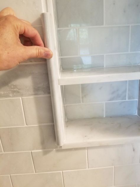 Shower Niche Finishing, Shower Niche Border Ideas, Porcelain Shower Niche, Shower Niche Edge Trim, Shower Niche Edging, Tiling A Shower Niche, Freestanding Bathtub Niche, Tub Niche Placement, Shower Niche Shelves