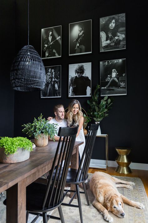 The prospect of painting the dining room walls a dark, inky hue didn’t scare the novice decorators. “It’s my favorite part,” says Booth. Adds Bristowe, “We were most excited to paint.” Buy It! Pendant light, $70; Kamron Windsor chairs, two for $260; worldmarket.com. Rock N Roll Living Room, Casa Rock, Couples Dining, Photowall Ideas, Dark Dining Room, Zimmer Diy, Kaitlyn Bristowe, Dining Room Remodel, Steampunk Decor