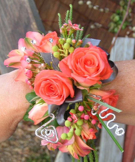 coral corsage with deco wire~Stems Flower Shop Coral Corsage, Prom Flowers Corsage, Corsage Ideas, Homecoming Flowers, Hoco 2024, Prom Corsages, Prom Corsage And Boutonniere, Homecoming Corsage, Wrist Corsage Prom