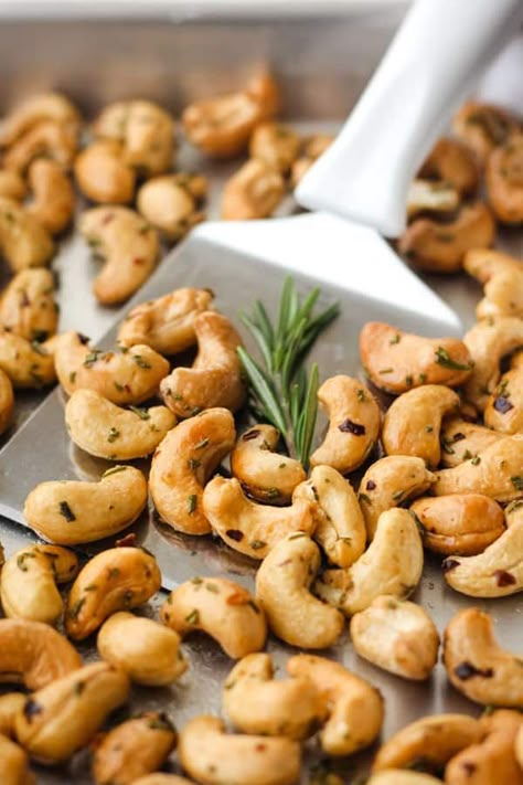 Rosemary cashews are an irresistible snack that’s loaded with savory-sweet flavor. Use your toaster oven to make this small batch recipe, it’s so easy! Seasoned Cashew Recipe, Roasted Cashews In The Oven, Oven Appetizers, Roasting Cashews In The Oven, Sweet And Spicy Roasted Cashews, Rosemary Roasted Cashews, Rosemary Cashews, Honey Roasted Cashews, Seasoned Nuts