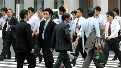 Businessmen are pictured crossing the street in Tokyo, Japan, on Tuesday, July 4, 2006. Photographer: Haruyoshi Yamaguchi/Bloomberg News. Japan Office, Hong Kong Art, Japanese People, Work Culture, Japan Culture, Bus Stop, Photo Reference, Business Man, New Era