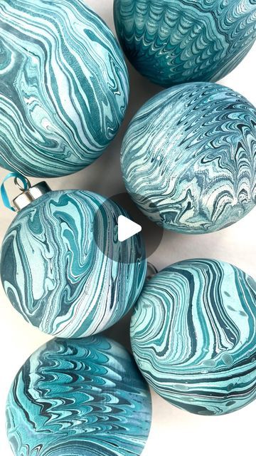 Mercedez Rex on Instagram: "Y’all I’m popping up this weekend and I’m bringing a DIY marbled ornament station for you to dip dye your own ceramic baubles 🤗 It’s gonna be cute! This Sunday Dec 10th 12-5 at @hotelmagdalena" Marbled Baubles Diy, Diy Marbled Ornaments, Marbling Ornaments Diy Christmas, Diy Ceramic Baubles, Paint Dipped Ornaments, Diy Christmas Baubles Craft Ideas, Marbelized Ornaments, Marble Ornaments Diy, Diy Baubles Christmas