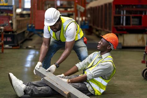 African American factory worker having accident while working in manufacturing site while his colleague is helping  for safety workplace and emergency concept Safety Workplace, Work Accident, Factory Worker, Logo Banners, Marketing Design, Custom Illustration, Custom Branding, Custom Packaging, Background Banner