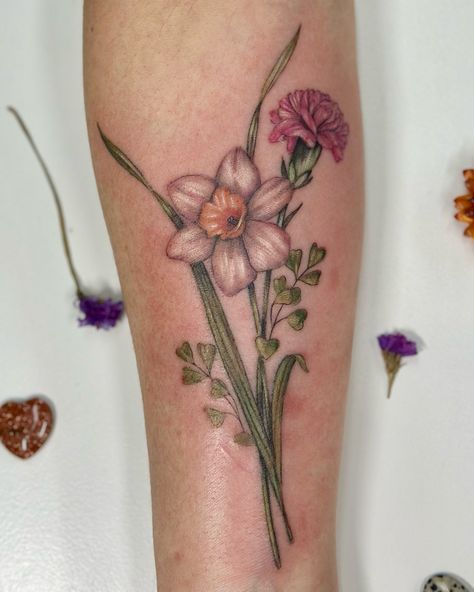 Daffodil and carnation bouquet 💐 Covered up a few scars 🪄 Send your idea with as many details as possible to lightgreystudio1@gmail.com Where on the body? Color or black and grey? Send inspiration images for placement and size. tattoo tattoos floraltattoo flowertattoo losangeles losangelestattoo tattooartist tattooideas rose tattoo Botanical tattoo Carnation And Daffodil Flower Tattoo, Carnation And Daffodil Tattoo, Daffodil Flower Tattoos, Grey Studio, Carnation Tattoo, Carnation Bouquet, Inspiration Images, Botanical Tattoo, Daffodil Flower