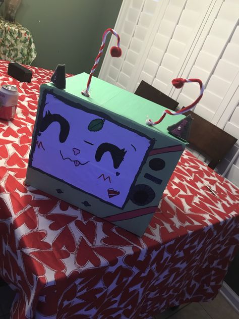 So this is my second box head or TV head her name is peppermint Tv Heads, Box Head, Tv Head, Dog Mask, Head Mask, Box Tv, Cute Crafts, Peppermint, Clock