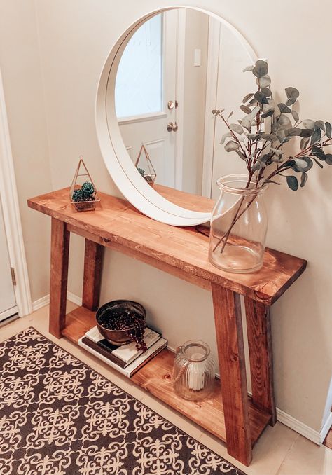 This console table features slightly tapered legs that adds subtle charm to its farmhouse style.Specifications:-48”x 11”D x 30”T-Choose your stain-Shown in Walnut-Customization is available to length and height Hallway Console Table Ideas, Diy Hallway Table, Front Entrance Table, Wood Console Table Entryway, Small Hallway Table, Front Entry Tables, Small Entry Tables, Diy Entryway Table, Entrance Table Decor