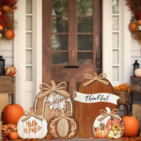 PRICES MAY VARY. Wood Pumpkin Porch Standing: our package includes 5 fall wood pumpkins with different styles and sizes; Each Thanksgiving wood pumpkin porch standing comes equipped with its own stand, enabling it to stand on its own; This distinctive feature gives you the freedom to place it anywhere you like, thus providing flexibility in enhancing your Fall and Thanksgiving decorations Wood Color Pumpkin Design: each wooden pumpkin in the package features a different pattern, adding a layered Yarn Business, Pumpkin Porch, Fall Decorations For Home, Home Front Door, Porch Pumpkins, Fall Planters, Door Kitchen, Wooden Pumpkins, Wood Pumpkins