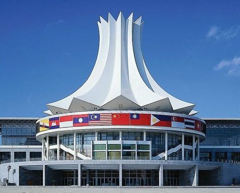 Nanning International #Convention & #Exhibition Center covers an area of 600 mu of land, and its main building covers 152,100 m2 in total. The building of the center is carefully designed and situated on mountains, with a magnificent looking. Its dome consists of twelve parts, like the petals of a hibiscus rosa-sinensis - the city flower of Nanning, which represent the twelve nationalities that have been lived in Guangxi from long ago. Convention And Exhibition Center, Nanning, Building Architecture, Beautiful Buildings, Supply Chain, Architecture Building, Marina Bay Sands, The Building, Nice View