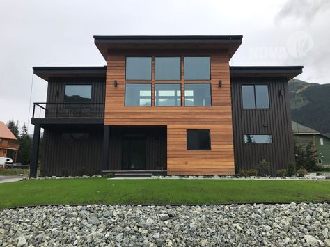 Black Metal Siding Exterior, Black And Wood Exterior House, Black And Wood House Exterior, Modern Siding Exterior, Metal Siding Exterior, Black And Cedar House Exterior, Modern Exterior House Colors, Modern Cabin Exterior, Metal Siding House