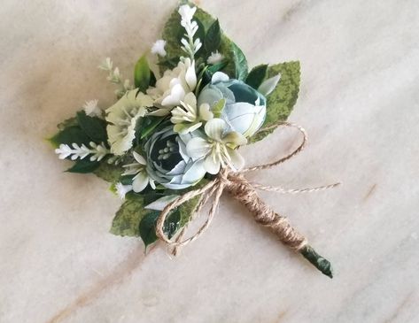 Please pay attention :Shipping to Europe takes 10-14  days. Shipping to US and Canada 3-4 weeks. Handmade floral boutonniere, The flowers and greenery are artificial. Every boutonniere is accompanied by pin.  You can order matching corsage, hair clip or pocket boutonniere.  16/10cm(length/wide) 6.5/4 inches The steam can be wrapped with silk ribbon, burlap or lace. Sage Green Corsage, Sage Boutonniere, Teal Boutonniere, Dance Asks, Enchanted Forest Prom, Green Boutonniere, Pocket Boutonniere, Blue Corsage, Floral Boutonniere