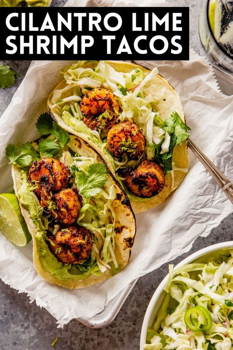 These Cilantro Lime Shrimp Tacos are what weeknight dinners should always be—fresh, healthy and incredibly easy to throw together! Spiced shrimp are seared briefly before getting stuffed into charred tortillas with a cilantro slaw and avocado crema. Shrimp Rolls Recipe, Lime Shrimp Tacos, Cilantro Lime Shrimp Tacos, Cilantro Slaw, Spiced Shrimp, Tacos With Avocado, Cilantro Lime Slaw, Shrimp Taco Recipes, Cilantro Lime Shrimp