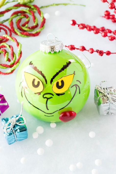 This DIY Grinch Ornament is easy to make and the perfect addition to any Christmas tree decor. Your heart will grow three sizes while making it! #grinch #grinchornament #diygrinchornament #homemadeornaments #DIY #grinchmas Diy Grinch Ornaments, Diy Grinch, Grinch Ornament, Grinch Crafts, Grinch Christmas Tree, Grinch Ornaments, Grinch Christmas Decorations, Homemade Ornaments, Christmas Crafts To Make