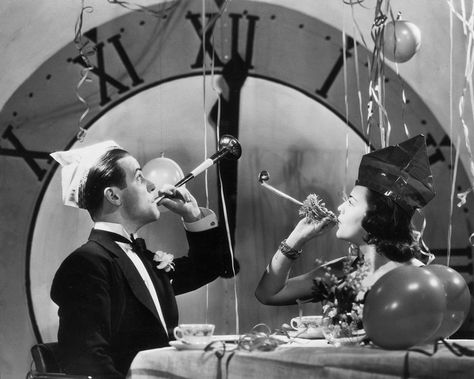 A couple ring in the New Year with party blowers and streamers, circa 1930. Photo: FPG, Getty Images / 2004 Getty Images Couples Vintage, Party Blowers, Vintage Photo Prints, New Year's Eve Celebrations, Images Vintage, Photo Vintage, New Year Holidays, Eve Parties, New Year Celebration