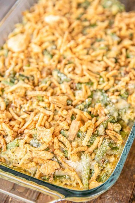 Green Bean & Artichoke Casserole - a delicious twist on our traditional green bean casserole! This is not your Grandmother's green bean casserole! NO cream of mushroom soup! Fresh green beans, artichoke hearts, onion, Italian bread crumbs, Italian seasoning, heavy cream, parmesan cheese, and french fried onions. Can make in advance and refrigerate or freeze for later. A MUST for your holiday meal! #greenbeancasserole #thanksgiving #christmas #casserole #greenbean #artichoke #sidedish Holiday Green Bean Casserole, The Best Green Bean Casserole, Artichoke Casserole, Traditional Green Bean Casserole, Italian Green Beans, Delicious Green Beans, Best Green Bean Casserole, Mushroom Side Dishes, Christmas Casserole