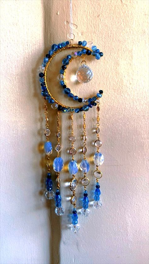 Decorate your space with this Lighy Blue and Navy Crescent Moon sun catcher crafted with genuine crystal beads, charms, and a crystal prism that reflects rainbows in direct sunlight.  Handmade with love! Add some positive energy to any space by hanging on a window in direct sunlight. Perfect for tiny homes and van lifers too! Makes the perfect gift for anyone and everyone who loves all things that sparkle and shine!!  ✨thank you for supporting my small business! I hope all the rainbows and spark Crystal Charms Diy, Small Suncatchers, Sun Catchers Diy, Van Lifers, Hippie Dorm, Easy Bracelet, Window Charm, Suncatcher Diy, Dorm Decoration