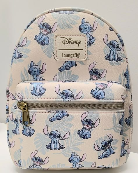 The photos for this listing are stock photos. This means that the print design on the bag shown in the pictures is not necessarily the exact bag that you will receive. It will have all the same characters. They just might be featured in different locations on the bag. This Loungefly Disney Lilo & Stitch Tropical Leaves Mini Backpack is perfect for any Disney fan! With a cute Stitch character design and tropical leaves accents, this backpack is a must-have accessory. The white handle/strap and brass hardware color create a stylish contrast with the multicolor exterior material of polyurethane. It's the perfect size for carrying your essentials, and the backpack style makes it easy and comfortable to wear for any occasion. Add this to your collection today! Approximate Size: 8 x 5 x 11 Inche Stitch Character Design, Lilo And Stitch Merchandise, Lilo And Stitch Quotes, Stitch Backpack, ليلو وستيتش, Stitch Toy, Lilo And Stitch Drawings, Stitch Quote, Stitch Character