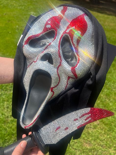 WILL BE OUT OF TOWN SEPTEMBER 9TH-24TH! I WILL SHIP EVERYTHING OUT AS SOON AS I CAN WHEN I GET BACK AND WILL KEEP YOU UPDATED ON YOUR ORDER! Handmade Bedazzled GhostFace Mask With Bedazzled Knife THIS IS MADE TO ORDER! Please wait 2-4 weeks for your order to ship out. I hand place almost 10,000 rhinestones on these items. I will also give plenty of updates and if you need it there sooner, please let me know. THERE IS A MINIMUM OF 7,000 RHINESTONES HAND APPLIED TO BOTH OF THESE COMBINED. The mask Bejeweled Scream Mask, Ghost Face Mask Rhinestone, Ghostface Mask Diy, Ghostface Glitter Mask, Bedazzled Halloween Mask, Bedazzled Knife, Bedazzled Ghostface Mask, Rhinestone Ghostface Mask, Ghost Face Rhinestone