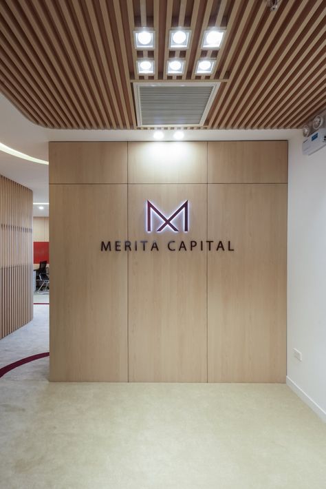 Merita Capital Offices - Hanoi - Office Snapshots Reception Logo Wall Design, Logo Wall Design Office Branding, Office Logo Wall Design, Office Logo Wall, Logo Wall Design, Office Signage Design, Executive Office Design Interior, Reception Waiting Area, Company Logo Wall