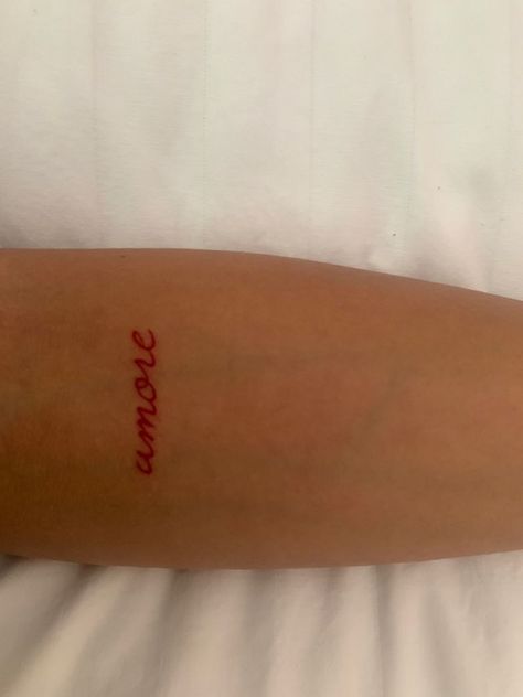 Amor Tattoo Cursive, Amor In Cursive Tattoo, Red Amore Tattoo, Red Amor Tattoo, Small Amor Tattoo, Amore Tattoo Cursive, Amor In Cursive, Amore Script Tattoo, Cool Edgy Tattoos