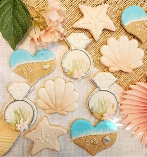 One dozen Beach themed cookies. Perfect for your wedding favors engagement party, bridal shower, Bachelorette party. Each dozen includes 3 Shells 3 rings, 3 Beach hearts, 3 starfish. Beachy Bridal Shower Ideas, All I Sea Is Love Bridal Shower Theme, Beach Theme Bridal Shower Ideas, Coastal Bridal Shower Ideas, Beach Wedding Cookies, Beach Bridal Shower Ideas, Beach Theme Desserts, Wedding Sugar Cookies, Beach Engagement Party