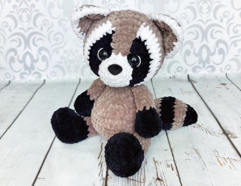 Make a fun gift for someone who loves a good stuffie with these 11 adorable animal crochet patterns that work up quick and look fantastic. Raccoon Crochet Pattern, Raccoon Crochet, Beginners Amigurumi, Toys Design, Fox Christmas, Amigurumi Plush, Animal Crochet, Amigurumi Animals, Crochet Elephant