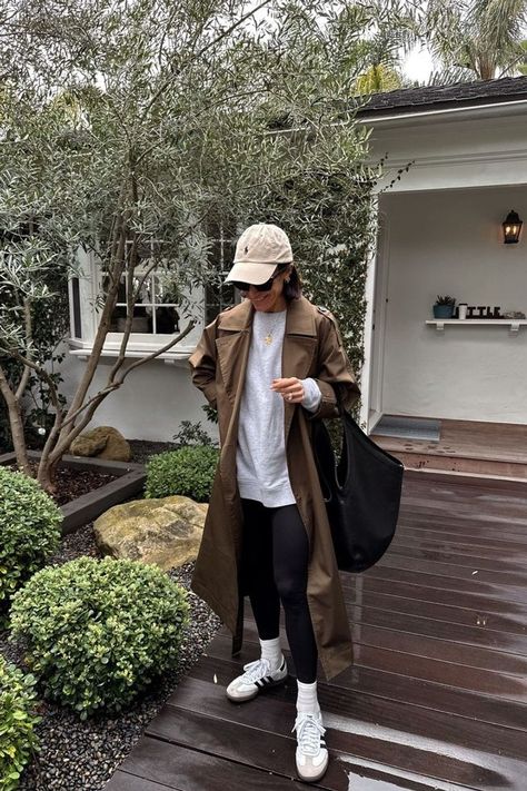 Trench Coat And Baseball Cap Outfit, Trench Coat Athletic Outfit, Trench Coat Athleisure, Airport Trench Coat Outfit, Casual Mom Style Winter, Casual Day Outfits Spring, Leggings And Trench Coat Outfit, Hoodie With Trench Coat Outfit, Trench Coat And Jeans Outfit