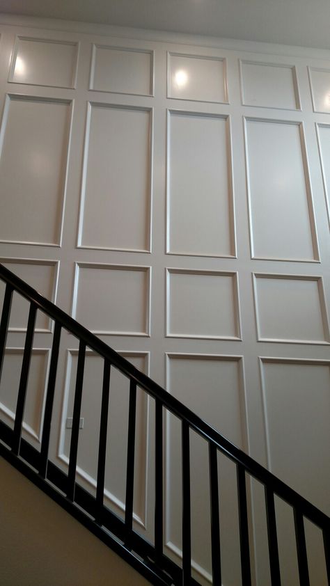 Wall Panels Stairway, Wall Panel Design Staircase, Panel Stairs Wall, Two Story Paneled Wall, Tall Wall Paneling, Wood Trim Accent Wall Staircase, Vaulted Ceiling Staircase Wall Decor, Wood Panel Staircase Wall, Wall Paneling On Stairs