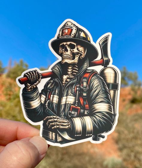 Brave bones blaze trails! Skeleton firefighter in full bunker gear, helmet secured, wielding ax courageously. A skeletal sentinel, ready to extinguish flames and conquer infernos. Embrace the spirit of fearlessness with this skeletal hero sticker! 2 cool designs to pick from, or just get them both! Great for your gear, water bottle, phone case, fridge, video game consoles, planner, locker, laptop or whatever else you put stickers on. Sticker printed on high quality vinyl paper and then laminated to help protect from the elements.  Choose from a variety of widths, the height varies depending on the width selected. Check out our shop to find many other stickers! Includes sticker only, other items in photos are only props. Firefighter Skeleton, Gear Tattoo, Firefighter Stickers, Firefighter Tattoo, Flame Decals, Helmet Tattoo, Firefighter Art, Firefighter Gear, Bunker Gear