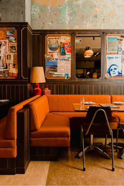 Midcentury Modern Restaurant Design, Restaurant Banquette Design, Mid Century Restaurant Design, Banquet Seating Restaurant, Mid Century Modern Bakery, 70s Restaurant Design, Colorful Restaurant Interior Design, Modern Sports Bar Design, Cozy Restaurant Aesthetic