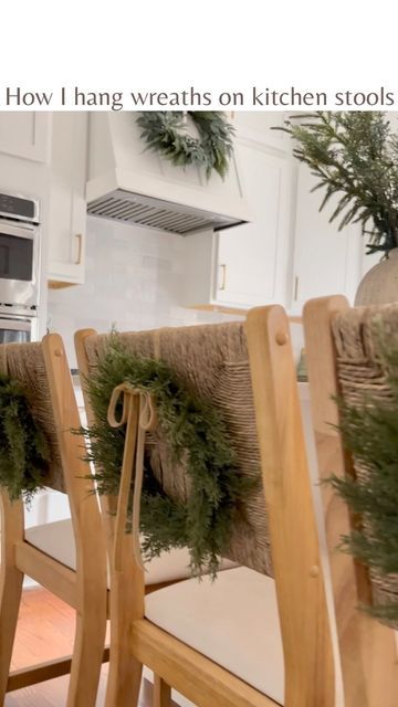 Bernice | DECOR | DESIGN | DIY on Instagram: "if you know the struggle of toddlers pulling down wreaths from dining chairs (that are obviously so perfectly within their reach), then this one is for you 😅 Also, because my stool backs are woven vertically, my earlier attempts with zip ties / ornament hooks / safety pins didn’t work out as they kept sliding down Now my toddler is pretty disappointed with this technique 😉 Making that bottom knot tight and hiding it behind the wreath is critical Wreath Hangers For Kitchen Chairs, Wreaths On Chairs Christmas Decor, Wreaths Behind Chairs, Wreaths For Kitchen Stools, Back Of Chair Christmas Decor, Wreath On Back Of Chair, Christmas Bar Stool Wreaths, Wreaths On Back Of Chairs, Wreaths On Barstools