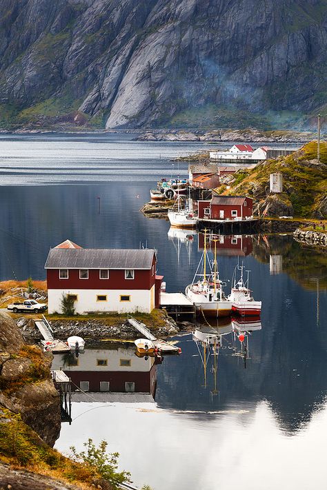 Fabrizio Fenoglio~ Photographer  "Sund Norway is a small village in the Lofoten islands. I spent very short time here but as usual I wanted to get some shoot: the light was not very good because it was cloudy but it was diffused everywhere and when I stopped my car on the hill just over the village I spot this beautiful corner with the characteristic red houses and some boats. The air was crisp and the sea very flat with marvelous reflections on it." City Scapes, Voyage Europe, Pretty Places, Dream Destinations, Places Around The World, Scandinavia, Wonderful Places, Travel Around The World, Vacation Spots