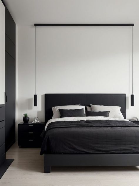 Create a bold and modern look in your bedroom with a matte black accent wall. Pair it with sleek and minimalistic furniture, such as a platform bed and a floating shelf, for a contemporary vibe. Matte Black Accent Wall, Dark Bedroom Interior, Black Bedroom Decor Ideas, Dark Minimalist Bedroom, Minimalistic Furniture, Black Accent Wall, Low Platform Bed, Black White Bedrooms, Monochrome Bedroom