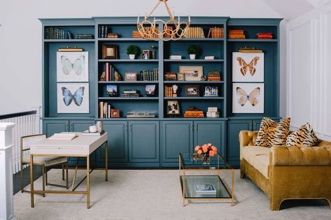 Custom-built shelving and cabinetry are painted in a rich teal hue. Jolie Paint, Cognac Leather Sofa, Wall Colours, Pool Room, Sesame Ginger, Ginger Dressing, Farmhouse Master, New Orleans Homes, Room Remodel