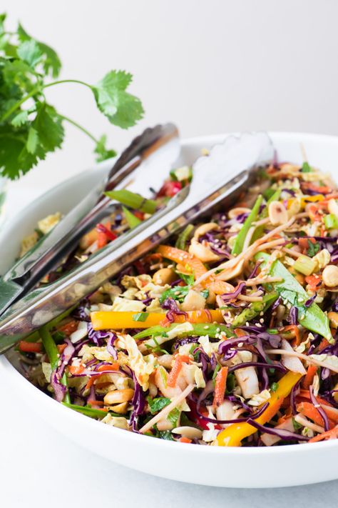 My vegan Asian Slaw with a creamy peanut dressing is a Chinese coleslaw with chow mein noddles that tastes so good you don't even realize how healthy it is. #dressing #best #spicy #creamy #easy #healthy #recipe #asian #chowmein #noodles #potluck #cabbage #vinegar #chicken #sidedish #salad #peanutdressing #vegan #vegetarian #chinese Asian Slaw Dressing, Asian Slaw Salad, Chowmein Noodles, Chinese Coleslaw, Asian Slaw Recipe, Asian Coleslaw, Asian Inspired Salad, Vinegar Chicken, Vegan Coleslaw