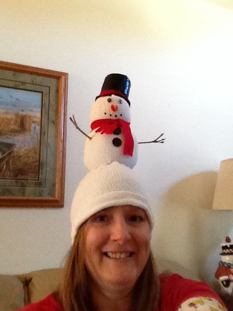 Our family does a crazy hat exchNge every year and it becomes a challenge to come up with new ideas. This is my Snowman hat made from sweatshirt sleeve turned inside out. A little top heavy bit cute. Crazy Christmas Hat Ideas, Diy Christmas Hat Funny, Crazy Christmas Hat Diy, Ugly Christmas Hat Ideas, Funny Christmas Hats Diy, Christmas Hats Diy, Crazy Christmas Hat, Christmas Hats Ideas, Snow Man Hat