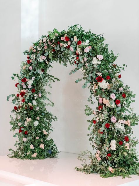 Wedding flower arch. Red, white and blush flowers. Event Planner: Kelly Doonan, Photographer: Josh & Dana Fernandez, Venue: The Revaire, Houston Wedding and Event Florist: Maxit Flower Design Red Roses Arch, Red Flower Arch Wedding, Red Flower Arch, Burgundy Floral Arch Wedding, Red And Pink Ceremony Flowers, Red And Pink Floral Arch, Red Centerpieces, Floral Archway, Wedding Archway