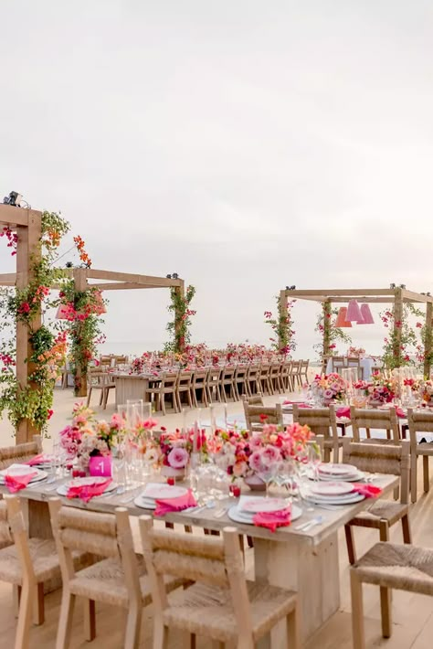 This colorful Cabo wedding is giving us boho Barbie vibes! Shade Of Pink Wedding, Red And Pink Tropical Wedding, Wedding With Pink Accents, Colorful Beach Wedding Decor, Garden Party Beach Wedding, Dreamy Summer Wedding, Pink Southern Wedding, Pink Inspired Wedding, Southern Charm Wedding Decorations