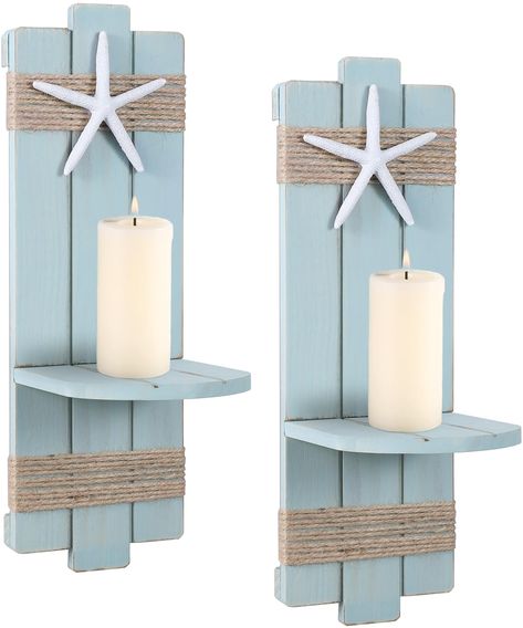 PRICES MAY VARY. Farmhouse Beach Charm: Add a touch of rustic elegance to your home decor with these vintage wood candle sconces.A resin starfish is attached to the hemp rope, lending a coastal and beach-inspired vibe to the candle holders. Handcrafted with Care: Each candlestick holder is constructed from high-quality wood, ensuring durability and longevity. The distressed finish gives them an authentic vintage look, adding character and charm to your decor. The set includes two candle holders, Beach Themed Room Decor, Coastal Room Decor, Seashell Candle Holder, Wall Candle Sconces, Wall Mounted Candle Holders, Seashell Candles, Wall Candle, Beach Bathroom Decor, Candle Displays