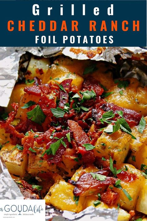 Grilled Cheddar Ranch Potatoes with crispy bacon cooked in foil packets. Finish with a dollop of sour cream - easy hobo camping or backyard recipe - can also be made in the oven. #potatoes #grilledpotatoes #foilpotatoes #potatoesinfoil #grillrecipes #summerrecipes #agoudalife Foil Potatoes On Grill, Foil Potatoes, Campfire Potatoes, Loaded Potatoes, Grilled Side Dishes, Foil Pack Meals, Foil Packs, Foil Packet Meals, Potato Dinner