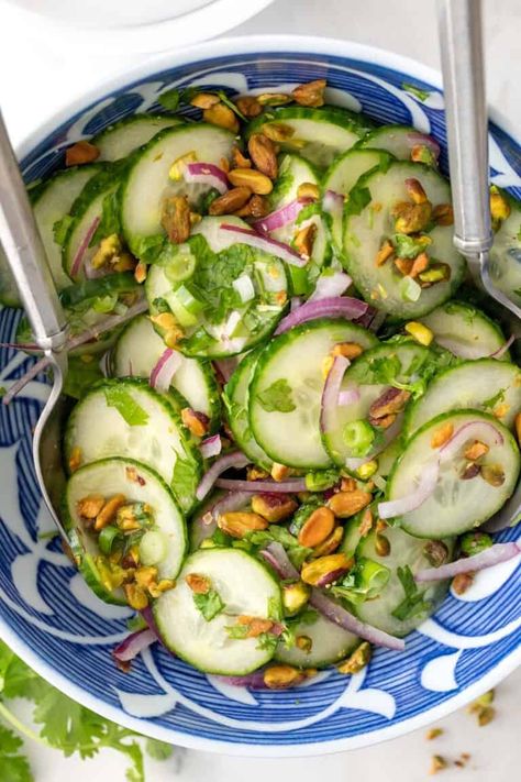 This easy Asian Cucumber Salad recipe is made with thinly sliced English cucumbers, red onion, pistachios and cilantro all tossed in a simple vinaigrette. This Asian salad with cucumbers comes together in a pinch and it rivals any restaurant salad out there! Indonesian Cucumber Salad, Easy Asian Cucumber Salad, Asian Cucumber Salad Recipe, Cucumber Benefits, Pistachio Recipes, Asian Cucumber Salad, Cucumber Salad Recipe, Side Salad Recipes, Harvest Kitchen