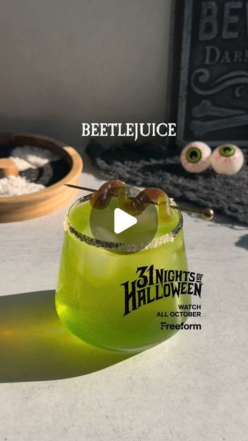 31 Nights Of Halloween on Instagram: "#FreeformPartner the juice is loose 🪲 watch beetlejuice tonight at 9p and all your favorites during #31nightsofhalloween all October on @freeform.

*disclaimer: no beetles were harmed in the making of this video

Rim glass w/ black and white sugar
1.5 oz vodka
.75 oz melon liqueur 
.75 oz lime juice
Shake with ice
Strain over ice
Top with ginger ale
Garnish with gummy worm" Beetle Juice Cocktail, Beetlejuice Party, 31 Nights Of Halloween, Gummy Worm, Melon Liqueur, Gummy Worms, Ginger Ale, Beetles, Beetlejuice